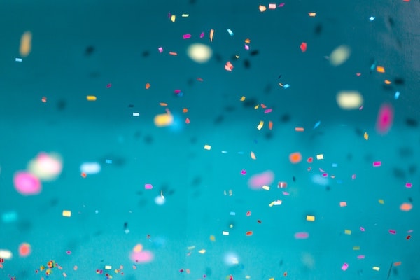 Image of confetti floating in the air.